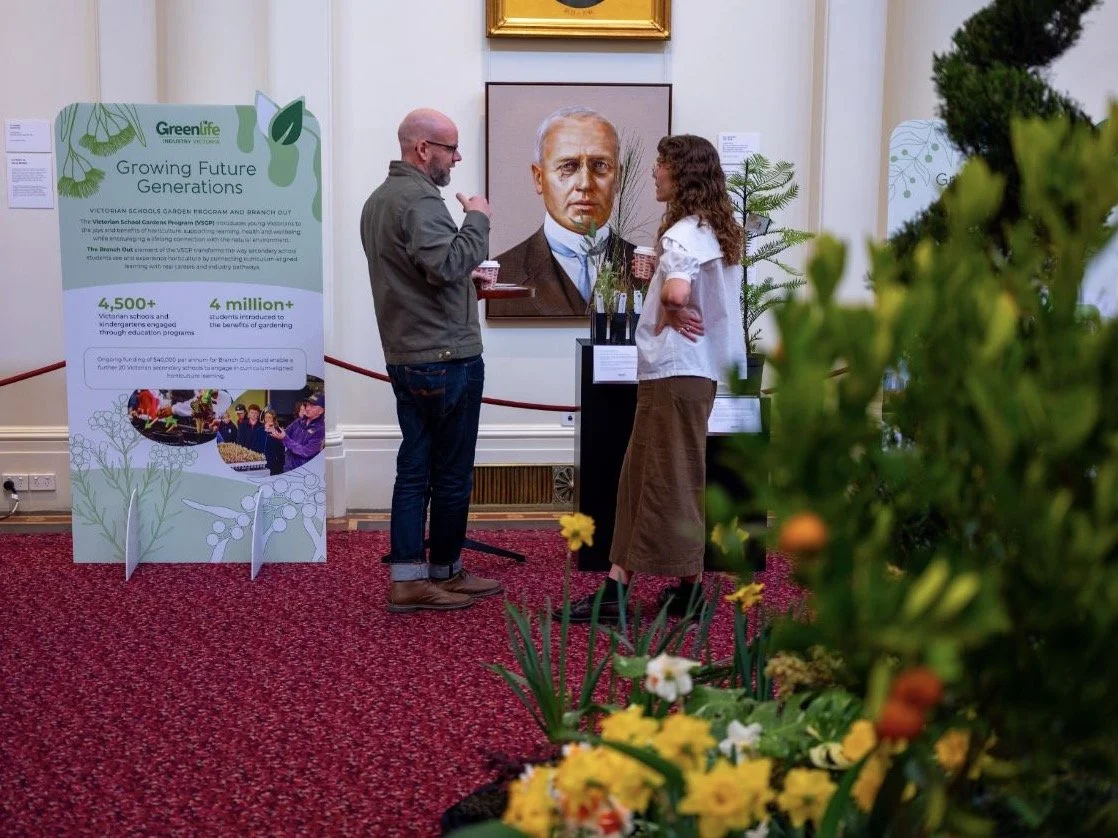 Visitors in conversation beside Greenlife Industry displays
