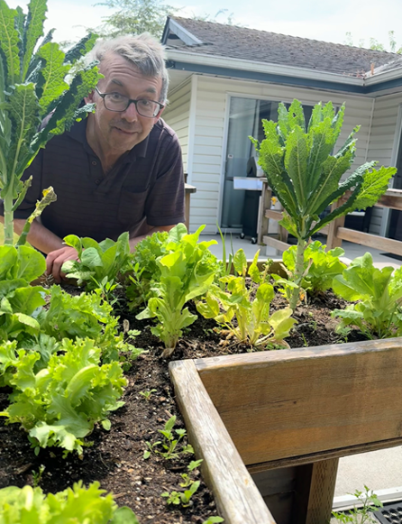 Resident with plants at CONNECT