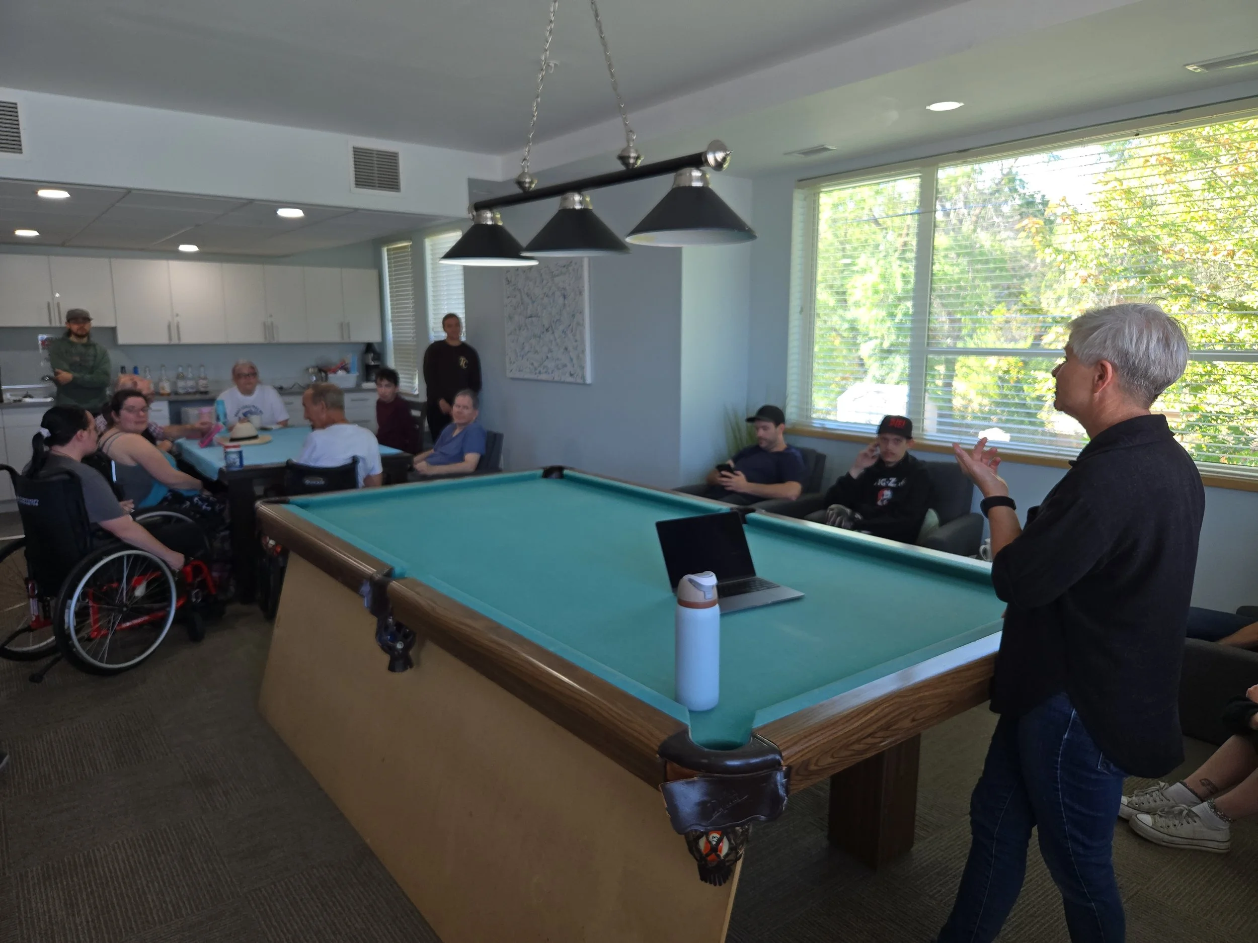 Karen Schmidt, Independence Coach, addressing residents at CONNECT Lake Country