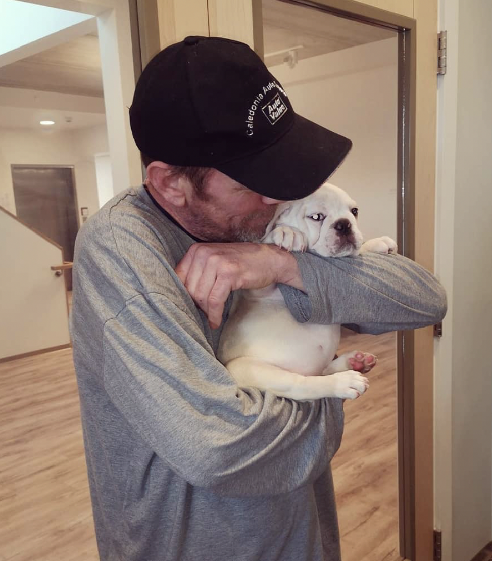 Resident with dog at CONNECT Hamilton