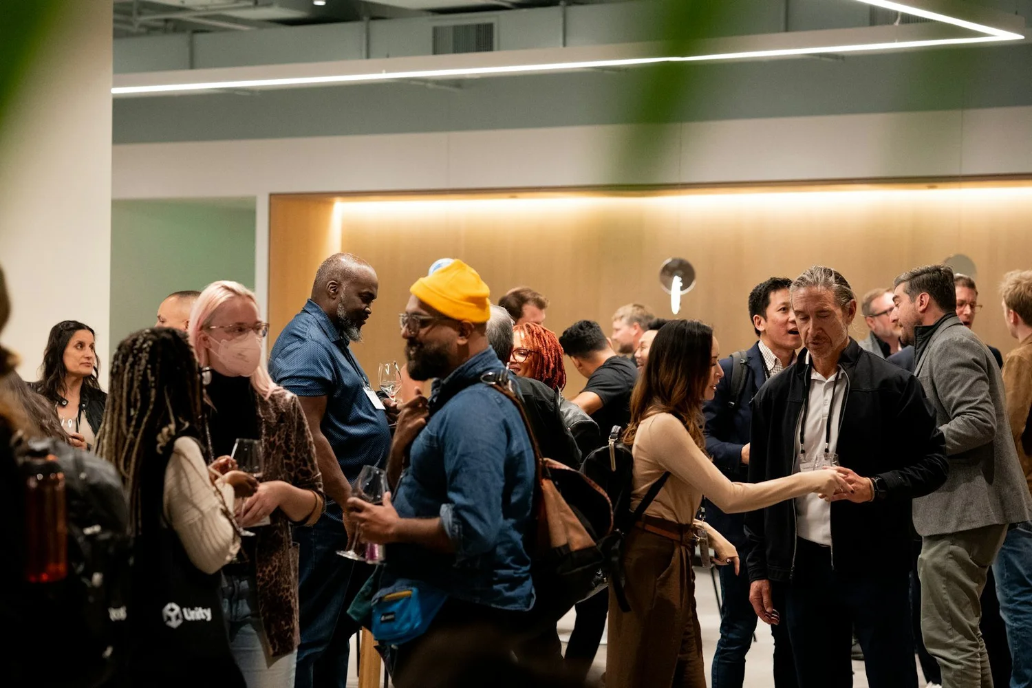 People mingling at an indoor networking event
