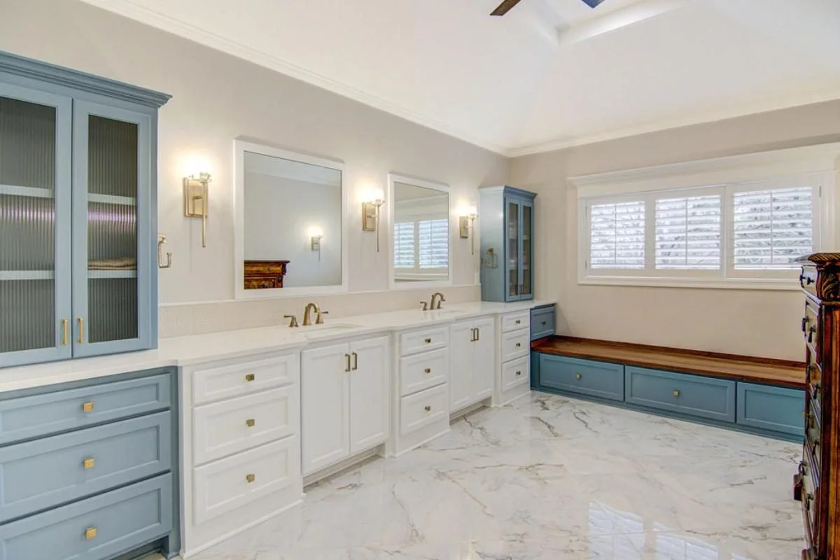 Blue and white bath vanity with bench