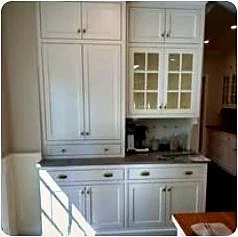 White shaker kitchen with glass uppers