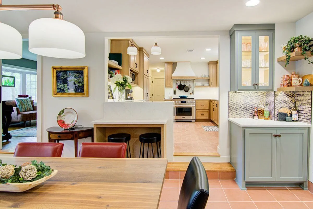 Sage cabinetry with dining view