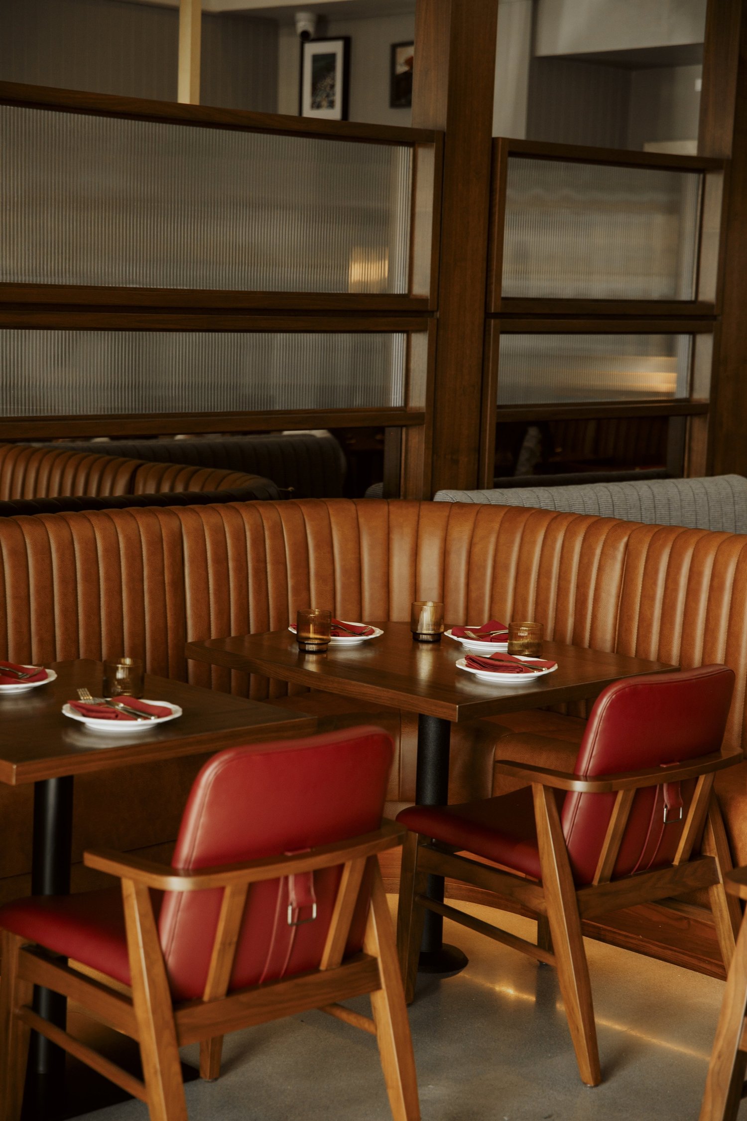 Salina's dining room with cognac booths and red leather chairs