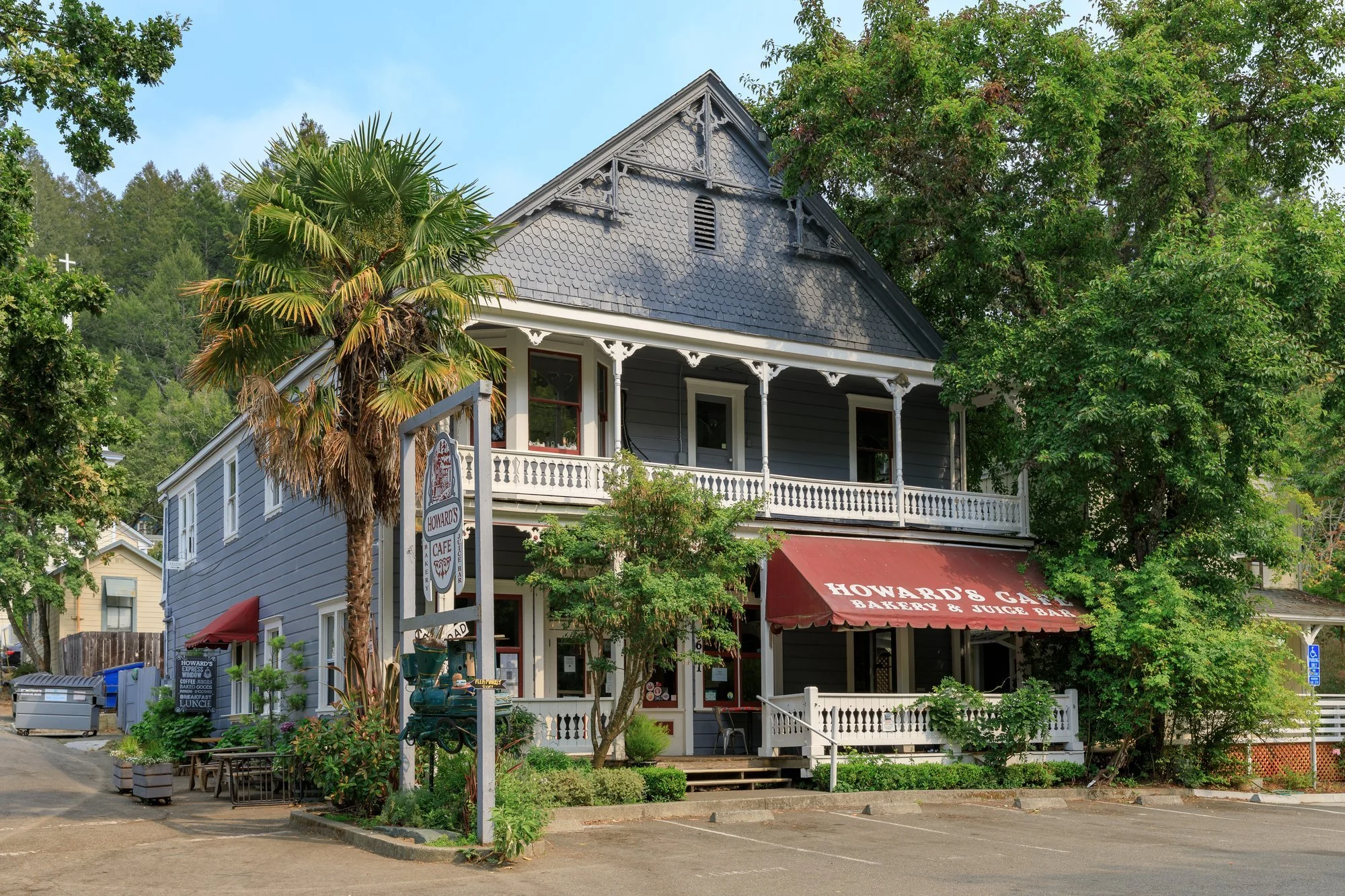 Victorian-style Howard's Cafe building with red awning on the Bohemian Highway in Occidental