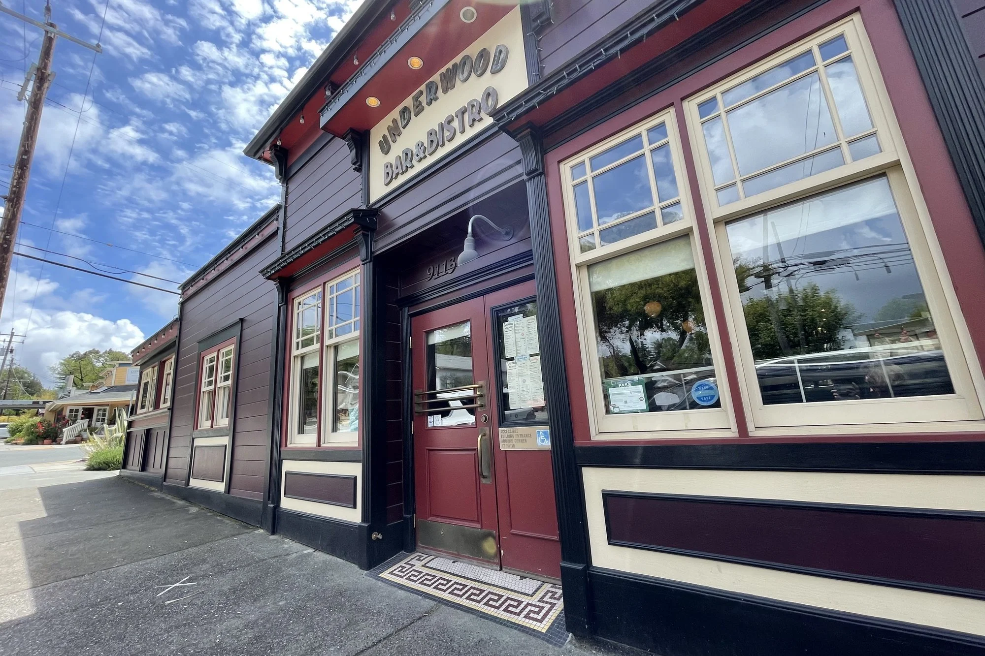 Dark red storefront and windows of the Underwood Bar and Bistro on Graton Road in downtown Graton