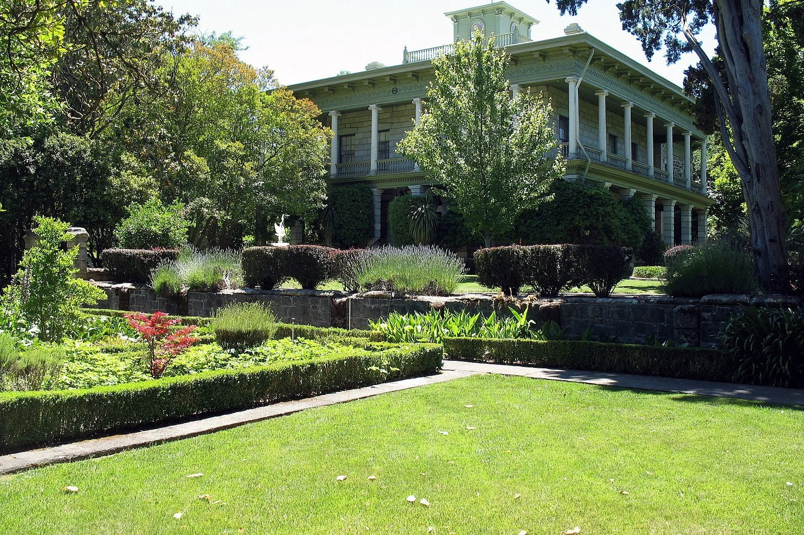 Temelec Hall seen across manicured lawns and gardens on Temelec Circle