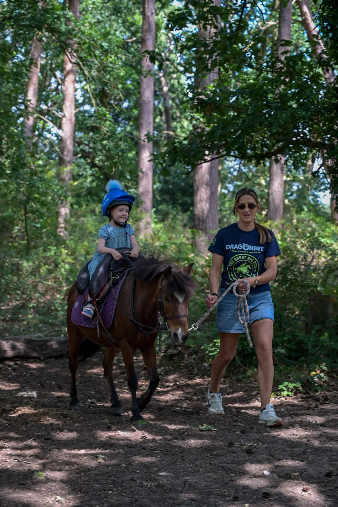 Child taking part with pony
