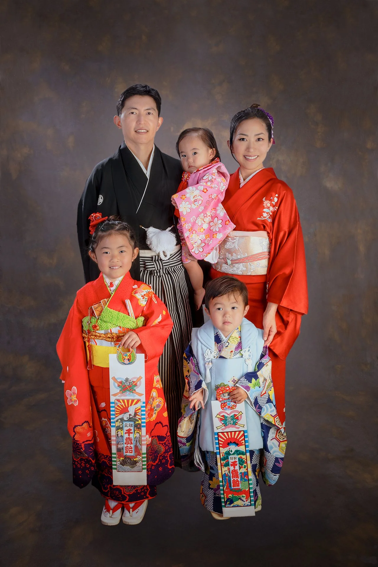 Family of five wearing kimono for a Shichi-Go-San portrait