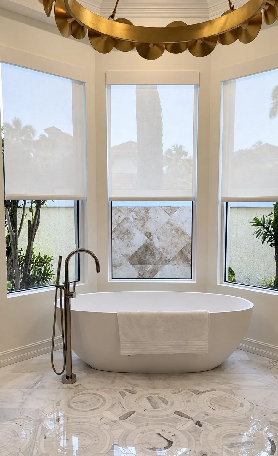 Three light-filtering roller shades around a freestanding bathtub