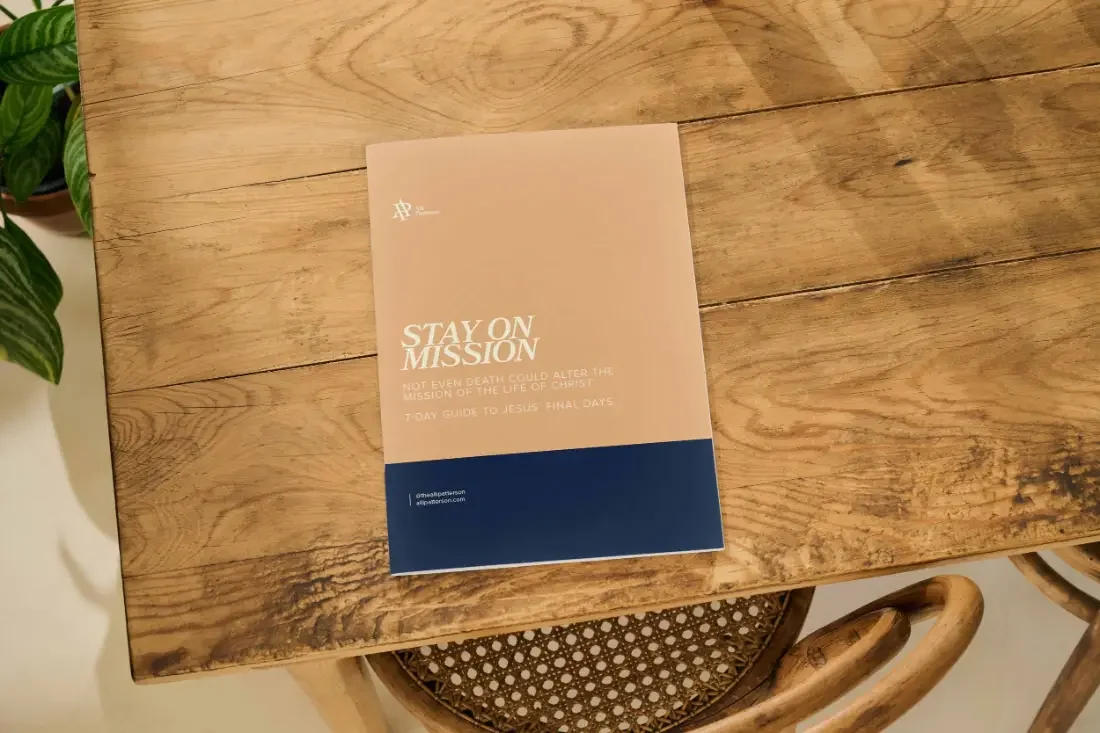 Stay on Mission Bible study cover in fawn and navy on a wooden table