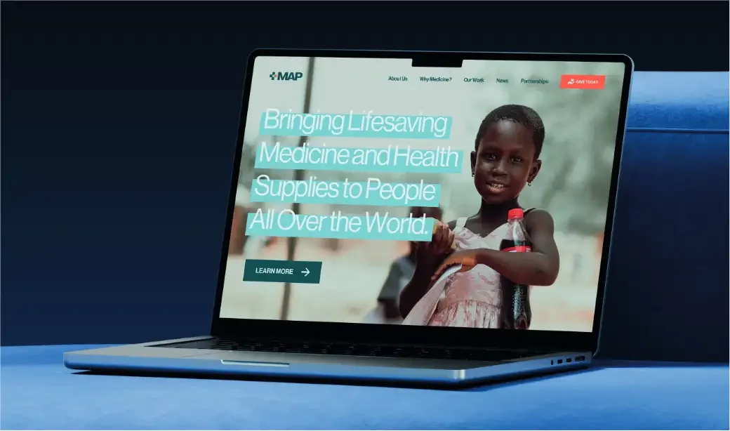A laptop showing a MAP homepage concept with the headline Bringing lifesaving medicine and health supplies to people all over the world