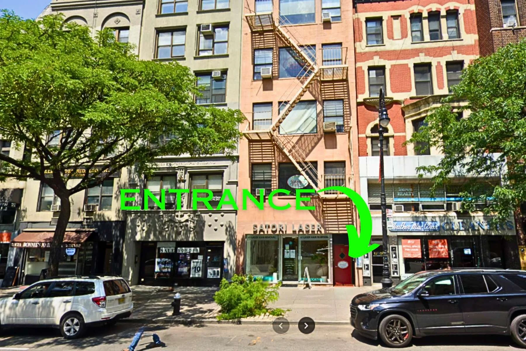 Ripley-Grier 72nd Street red entrance door beside Satori Laser
