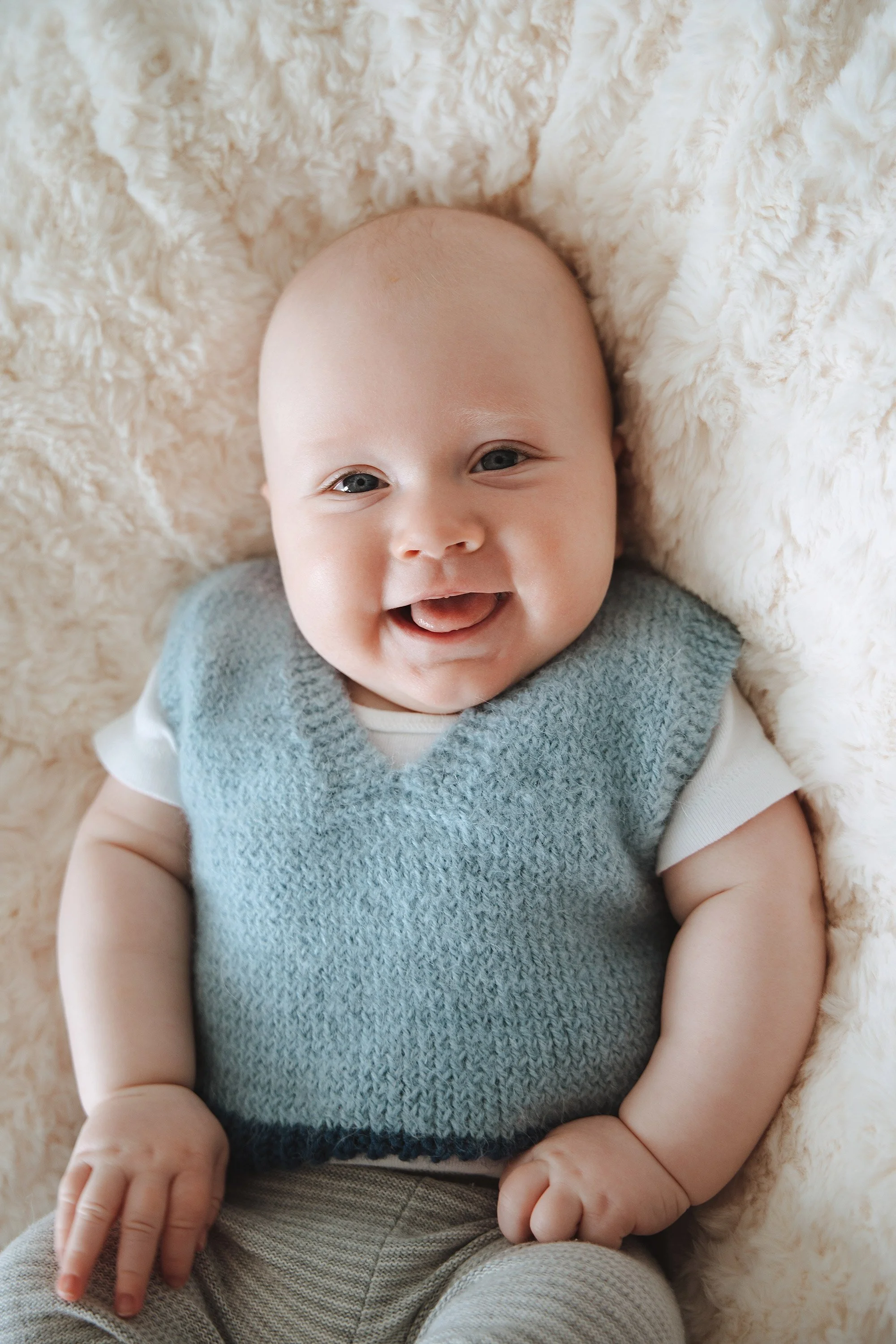 Newborn photography Brisbane — mum holding baby at Foxie Studio