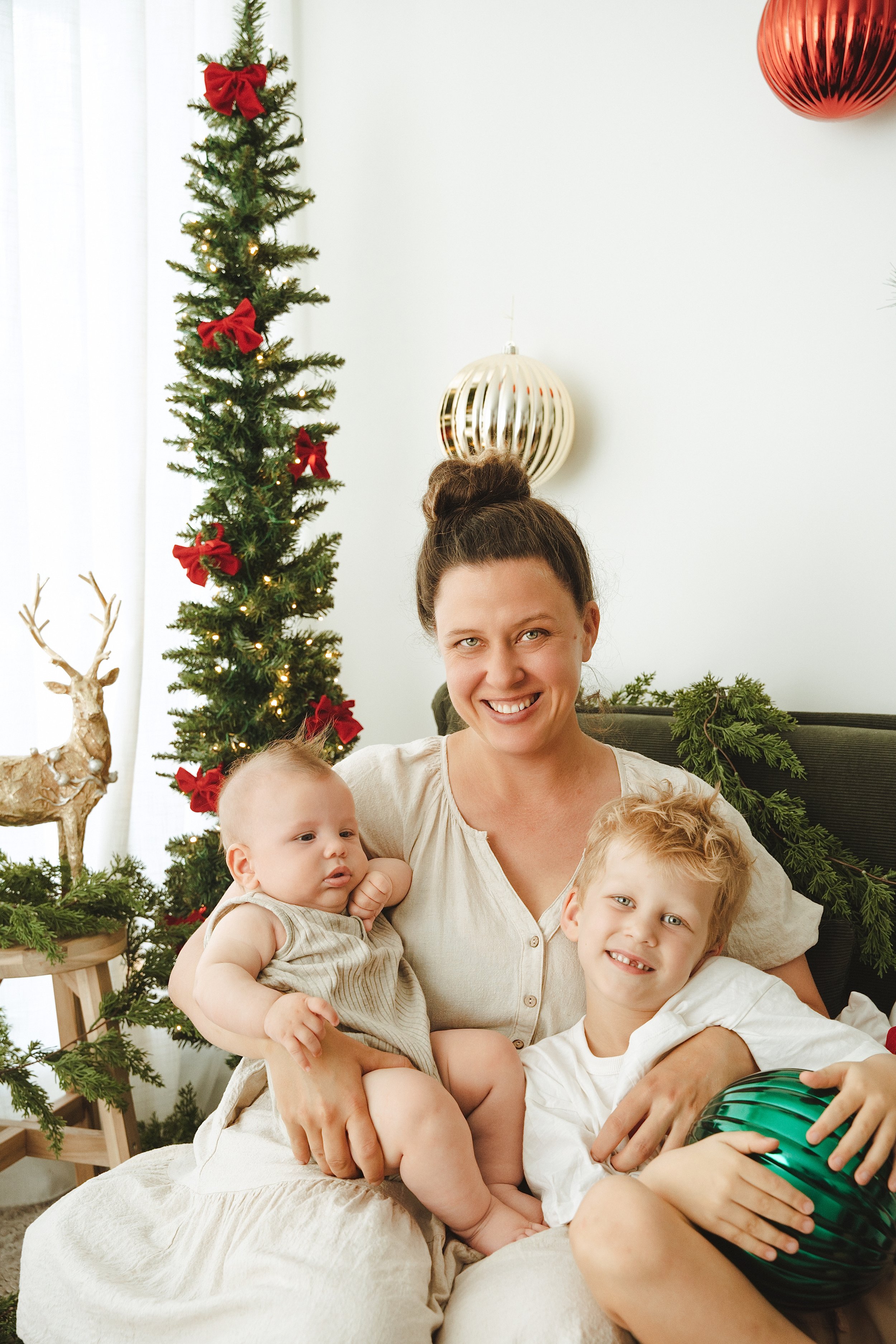 A family at a Foxie Studio Christmas session in Brisbane