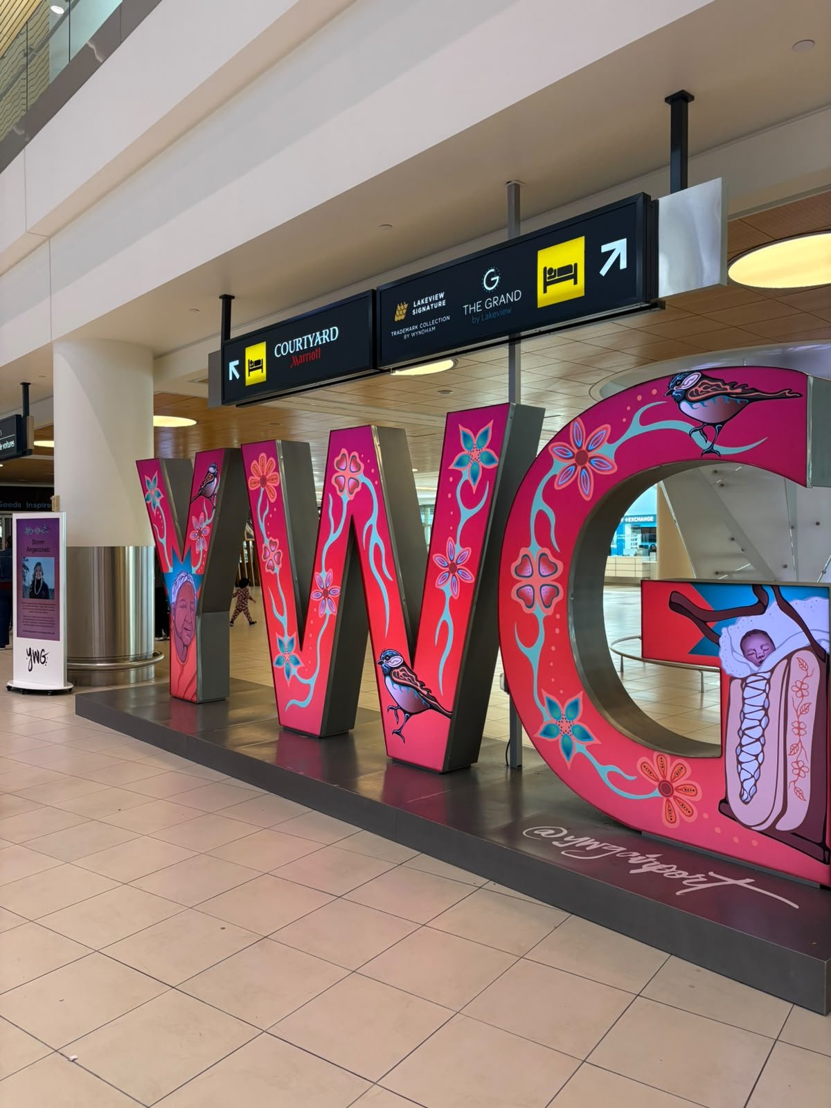Colourful YWG artwork at Winnipeg airport during VDJI’s National Black Canadians Summit visit.