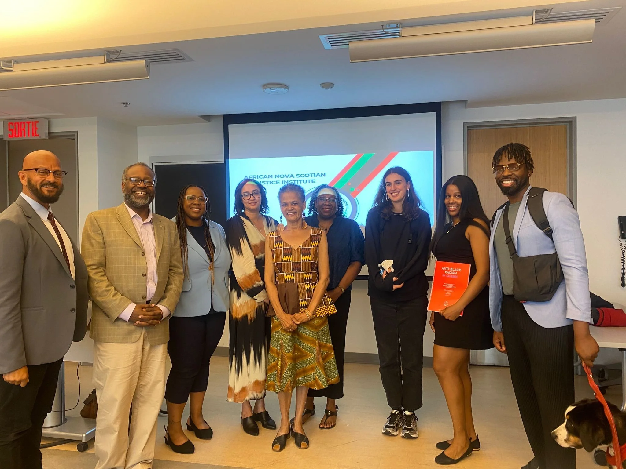 Participants gathered in front of an African Nova Scotian Justice Institute presentation.