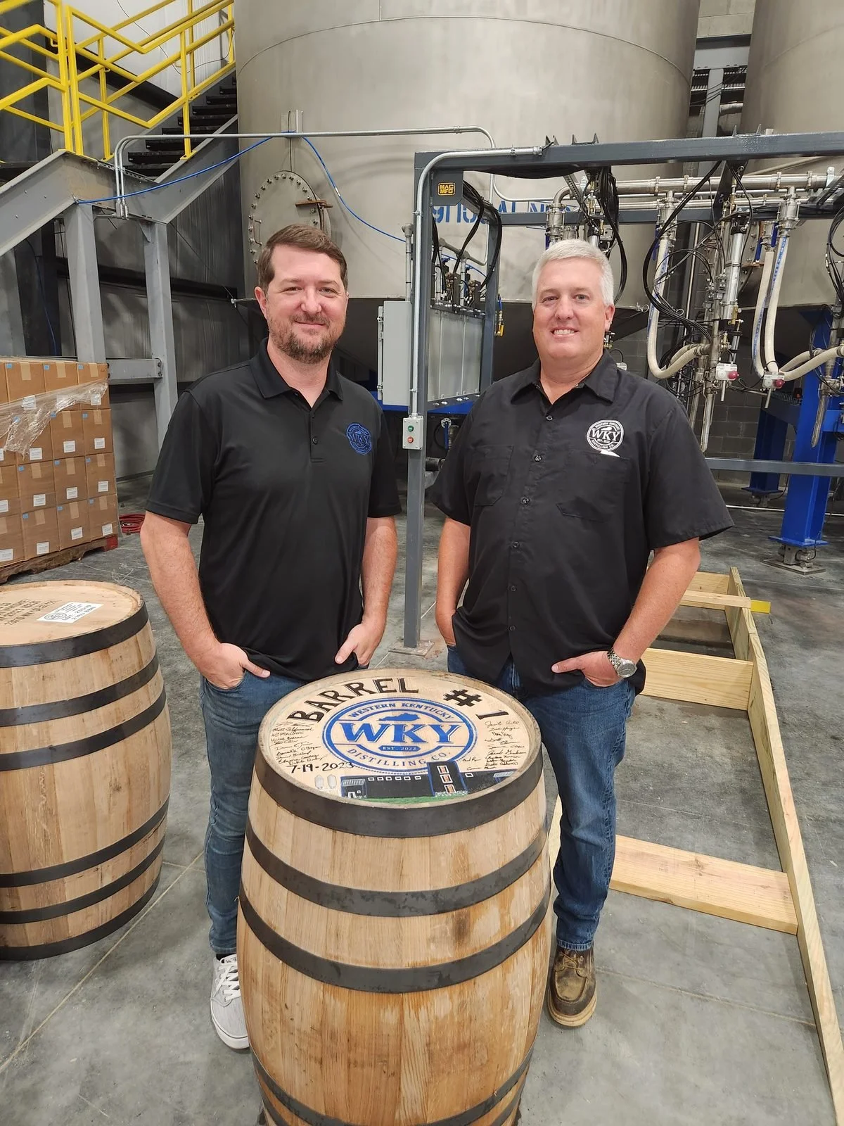 Zach and Jacob with Barrel No. 1 at the distillery, 2023