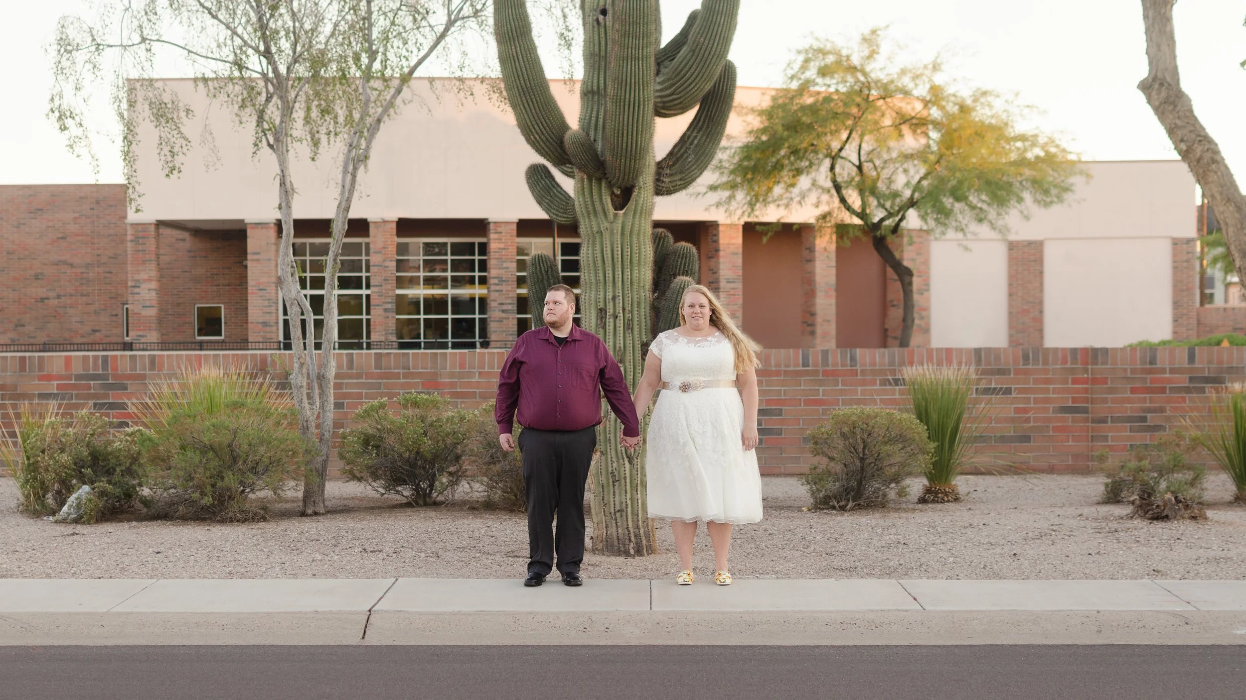 A couple holds hands