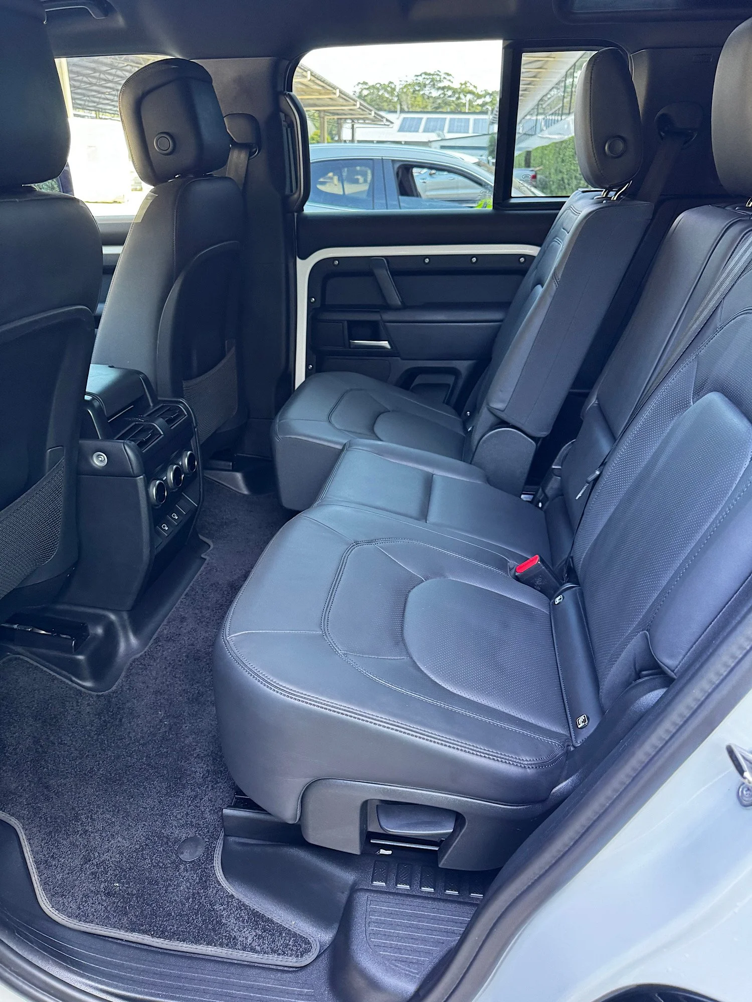 Land Rover Defender rear seats interior detailing clean after sand removal