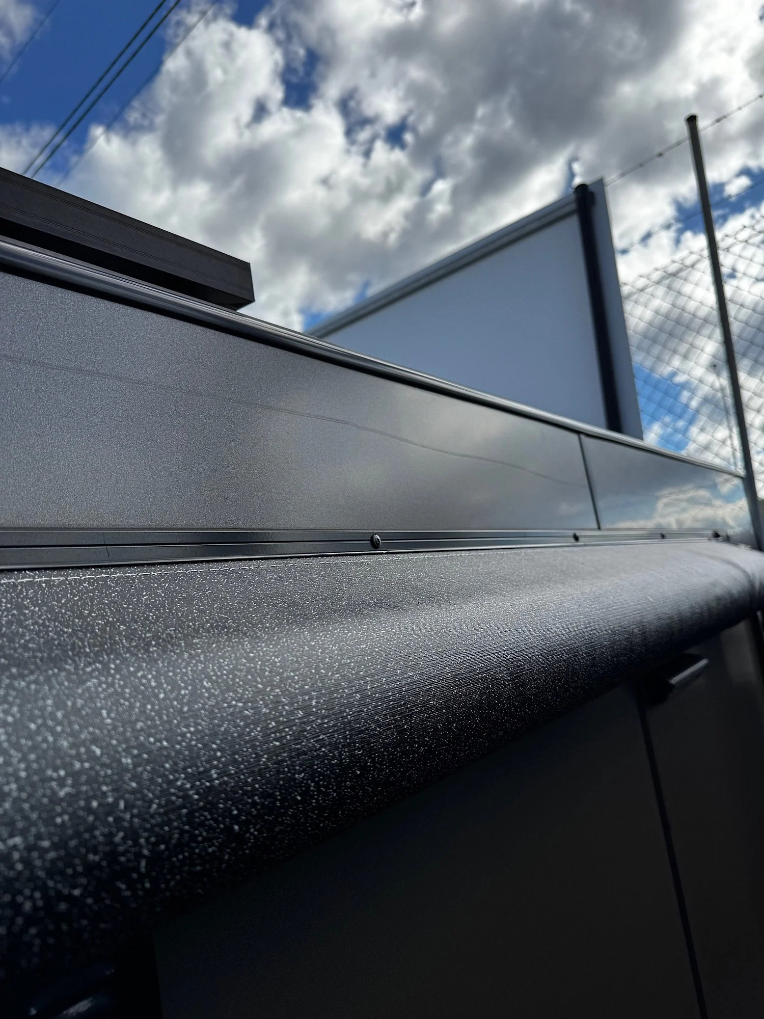 Branch scratches visible across caravan exterior panel before paint correction in Erina NSW