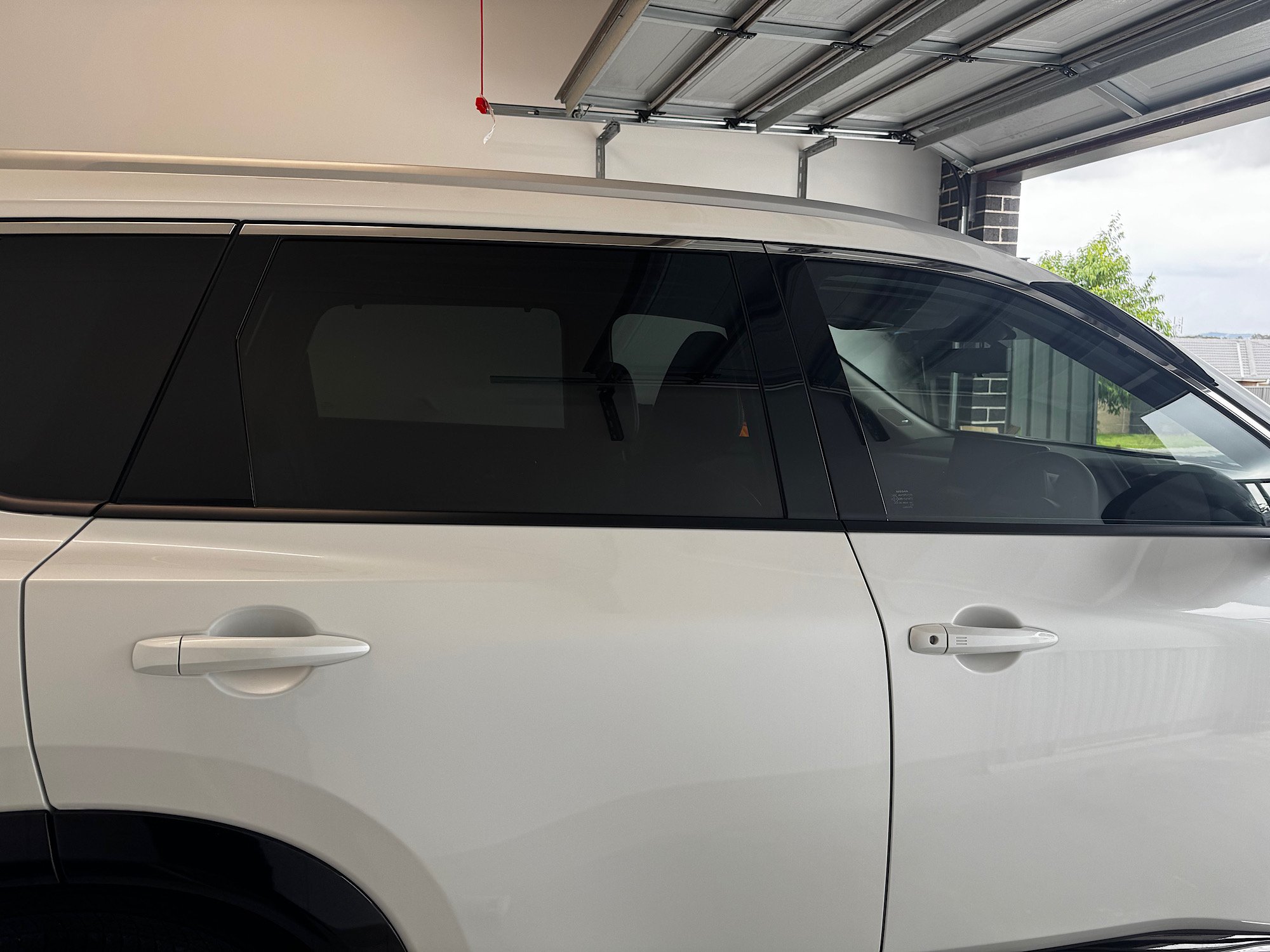 Nissan X-Trail e-4ORCE rear side window with 70 percent film over factory privacy glass