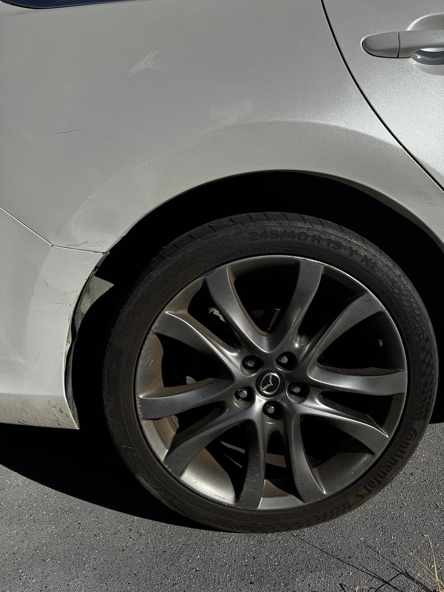 Mazda 6 wheel with brake dust and dirt buildup before detailing