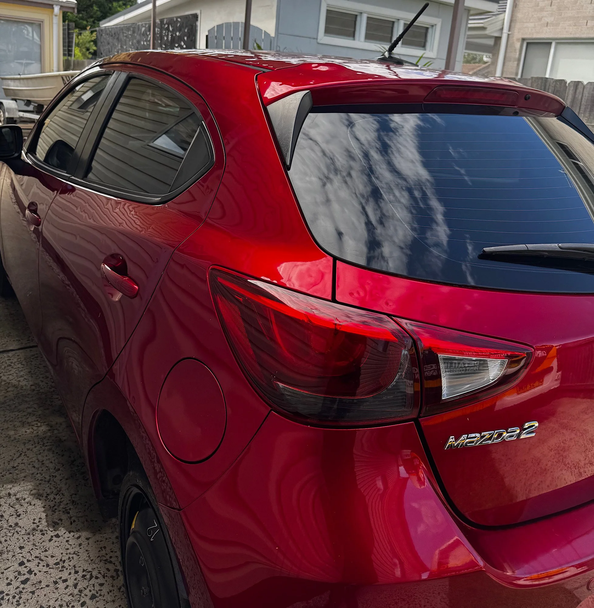 Mazda 2 Neo full window tint finished look clean glossy appearance