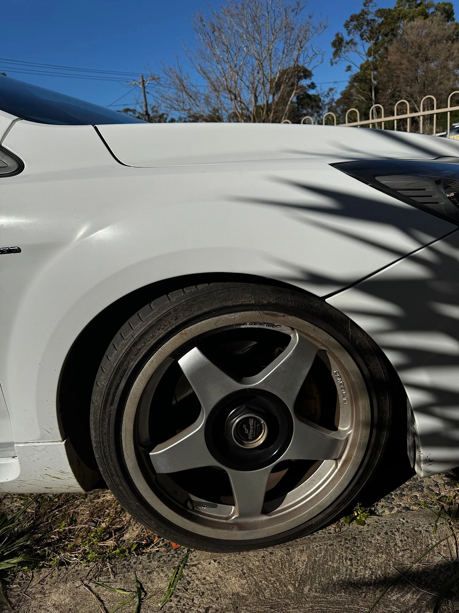 Front alloy wheel before cleaning on a Ford Focus XR5 Turbo during an extended detailing service.