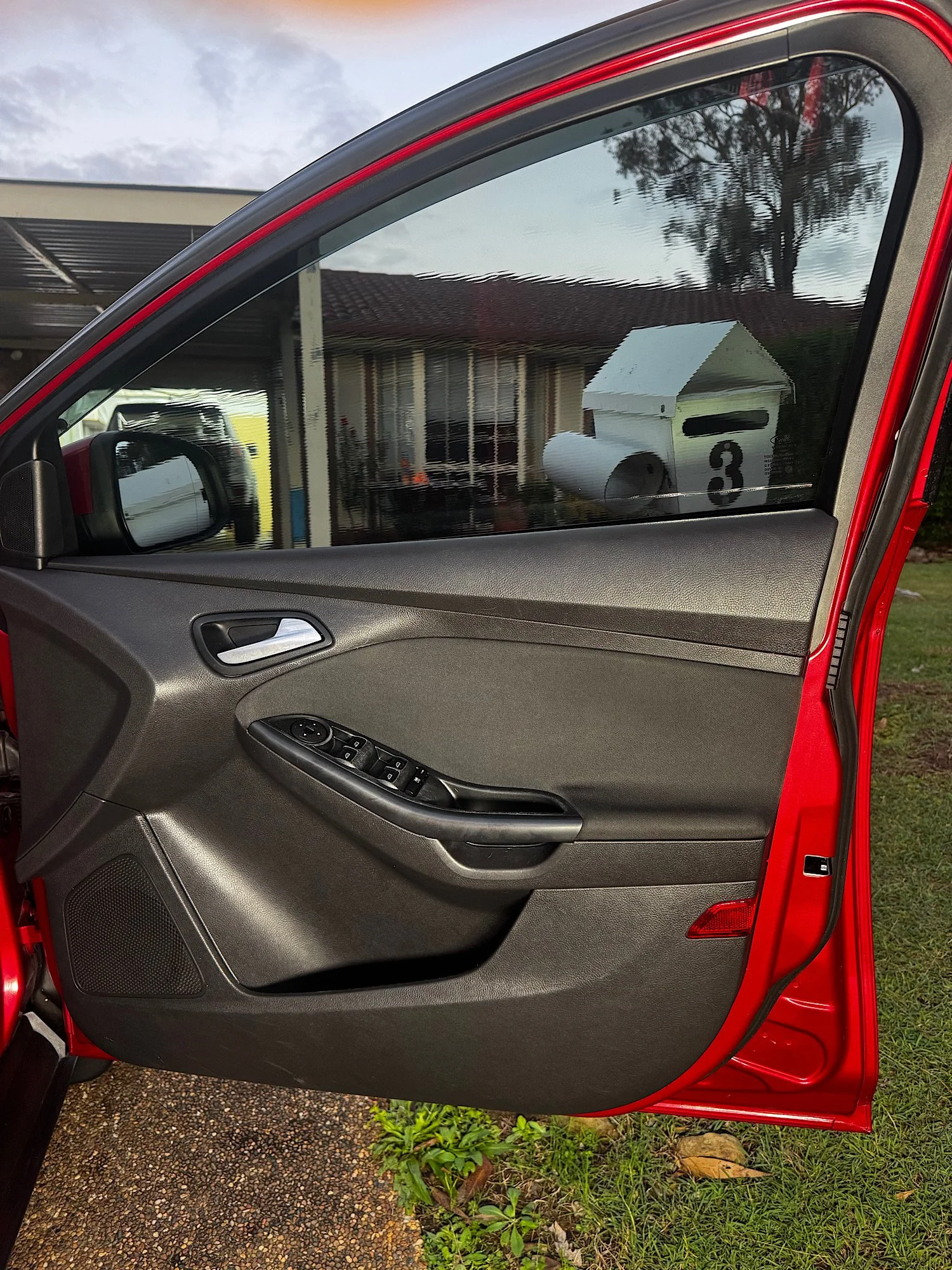 Driver side door panel after interior detailing and cleaning on Ford Focus