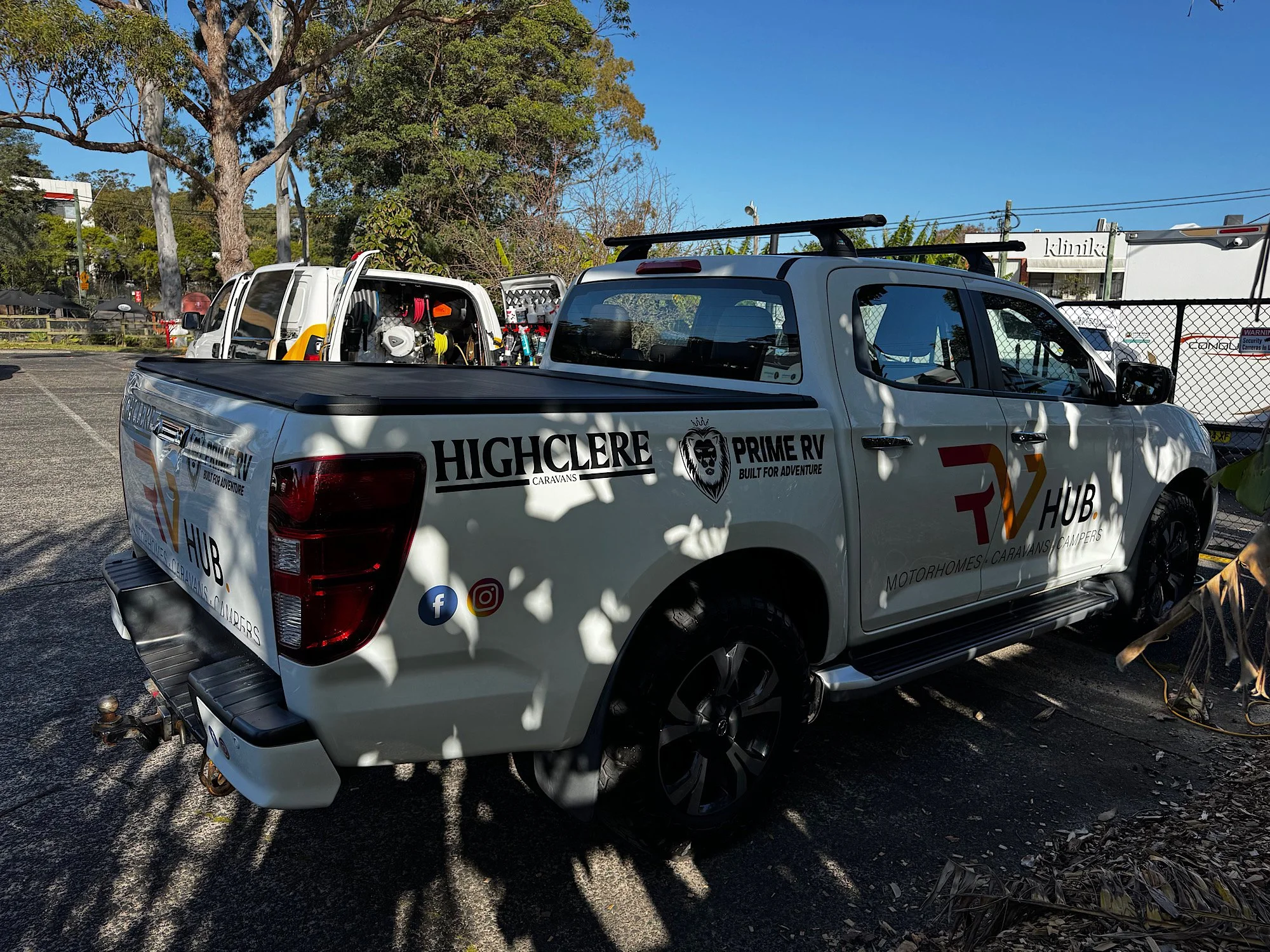 Rear three-quarter view of Mazda BT-50 before window tint and paint restoration