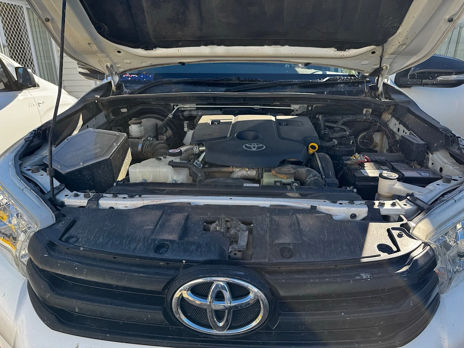 2017 Toyota Hilux engine bay before cleaning and detailing