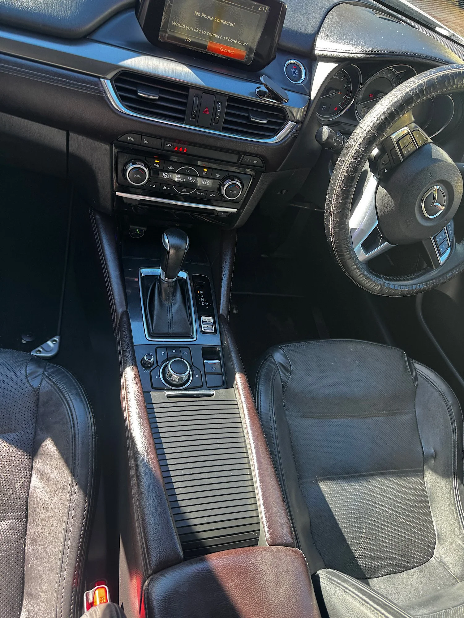 Clean center console and cup holders after interior detailing Mazda 6