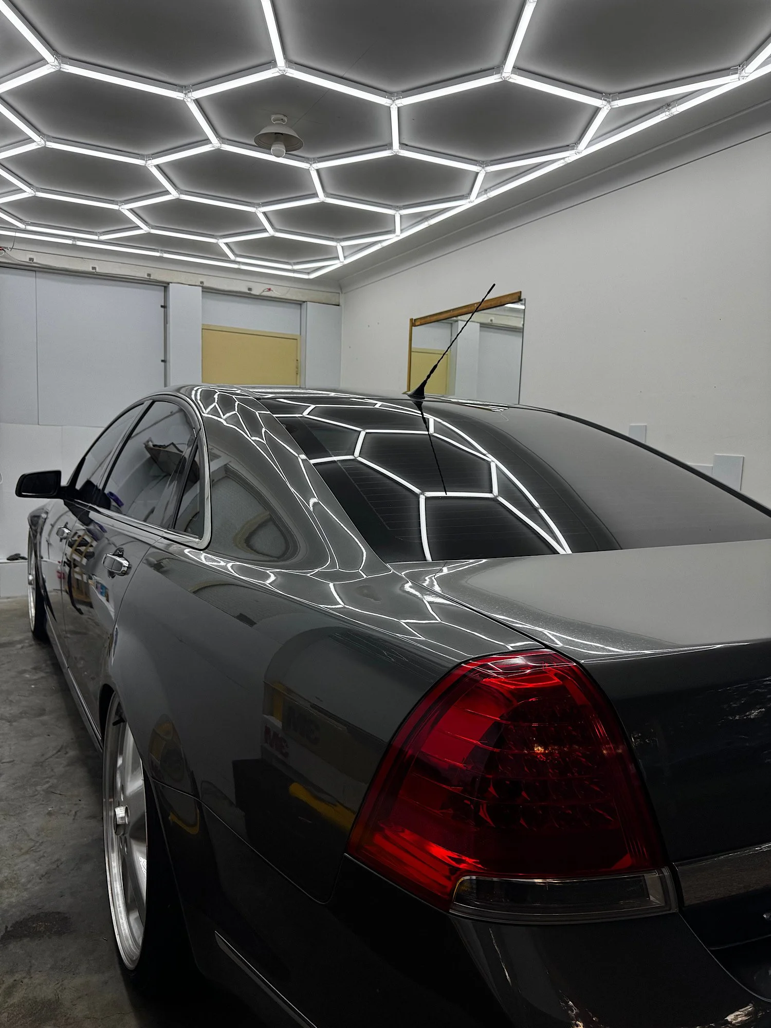 Holden Caprice V window tint inside RD Studio showing clean finish and lighting reflections