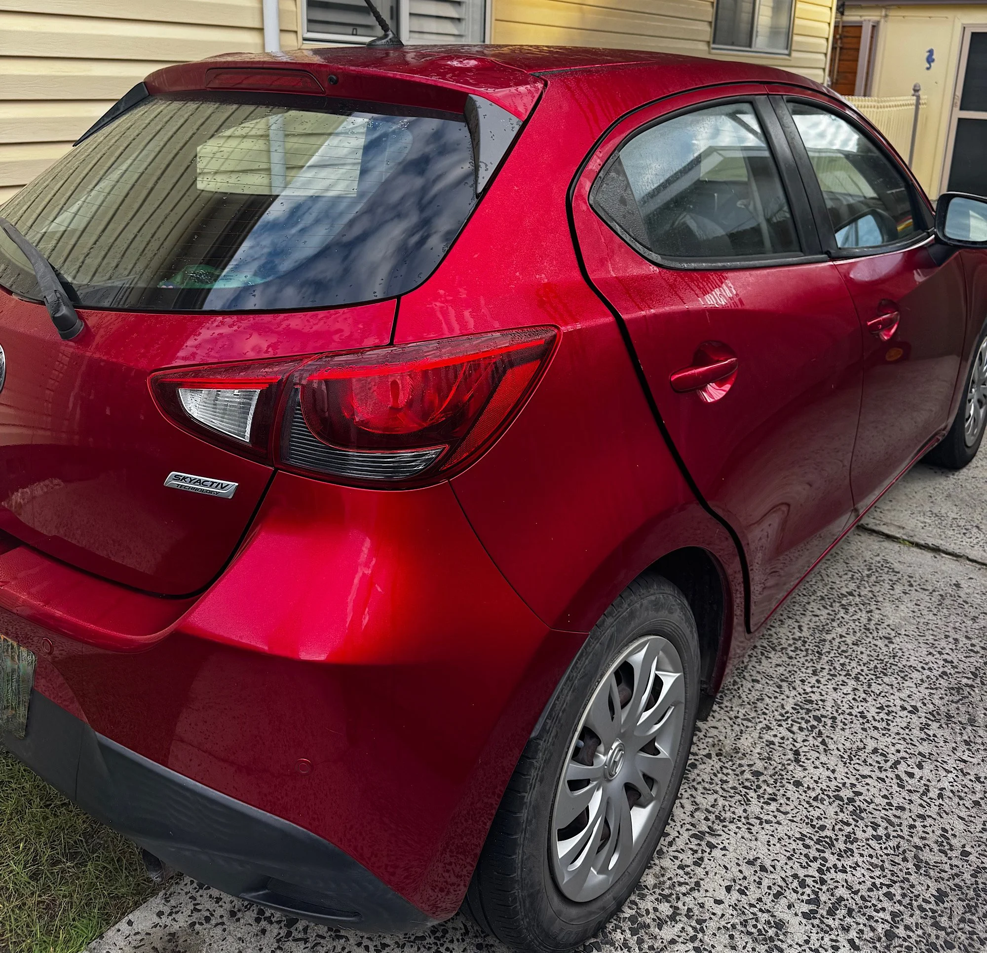 Mazda 2 Neo side profile before window tint installation in North Entrance NSW