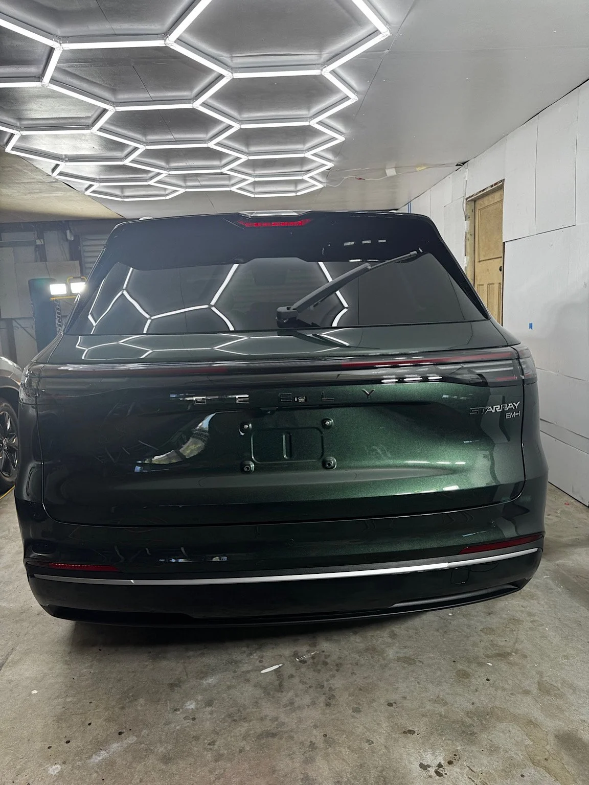Rear view of the completed dark green Geely Starray EM-i inside RD's Wyong studio