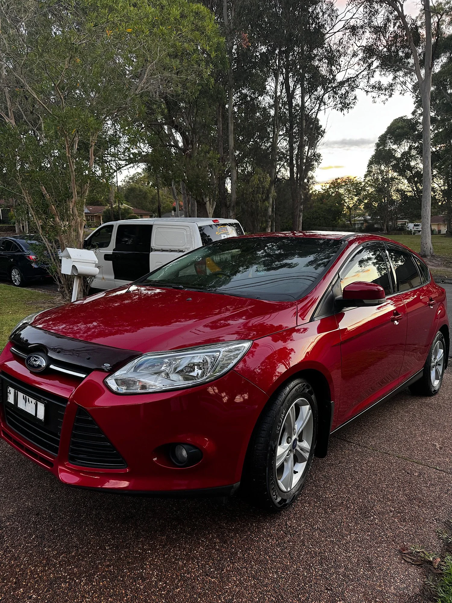 Ford Focus after detailing with restored red paint and gloss finish