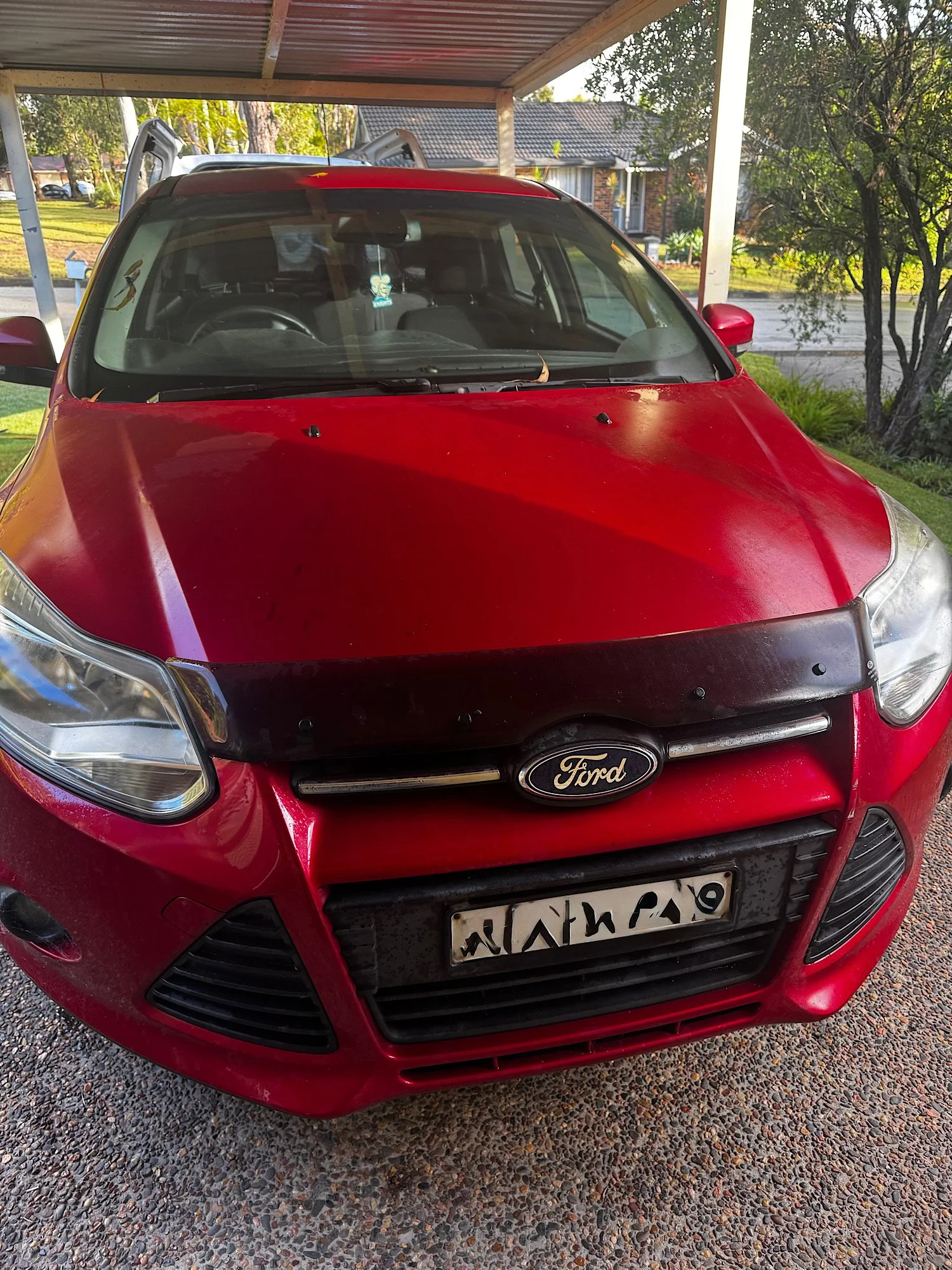 Front view of Ford Focus before detailing showing dull and oxidised paint
