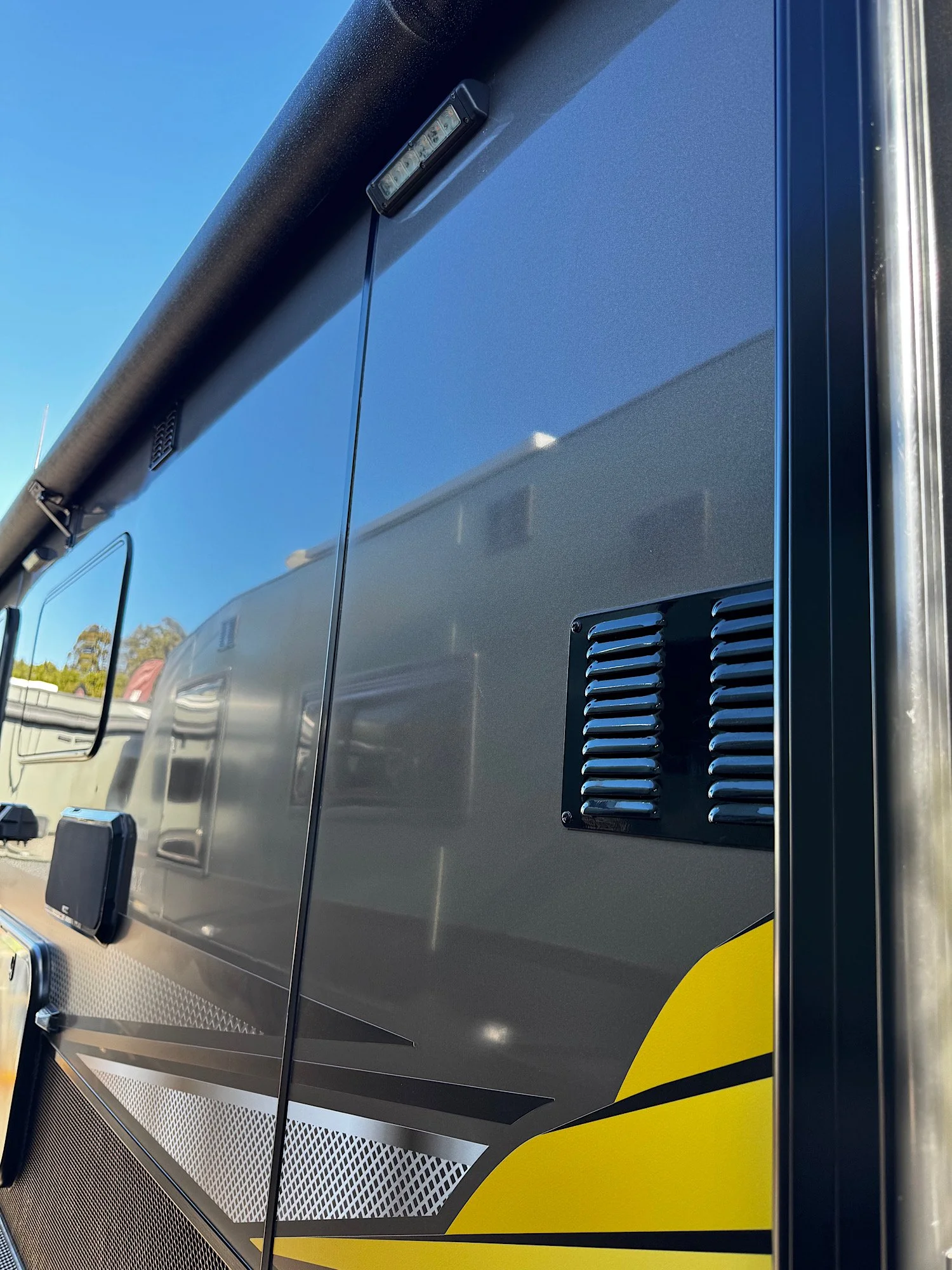 Restored caravan exterior after paint correction in Erina NSW