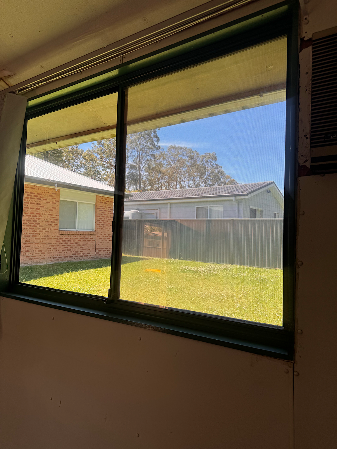 Shed window after Low-E window tint installation reducing glare and heat Central Coast NSW