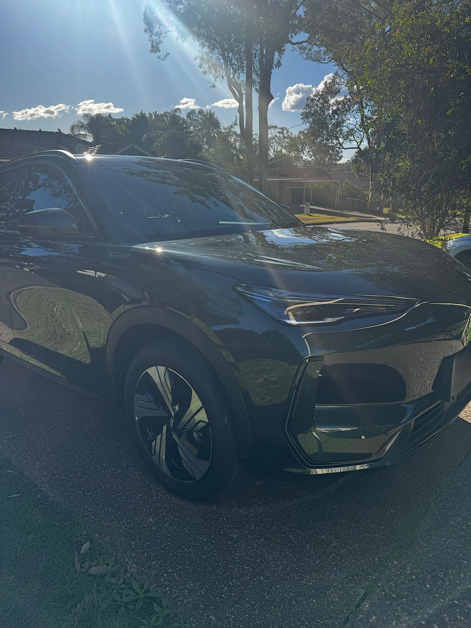 Front quarter view of Geely EX5 after ceramic coating in Umina NSW