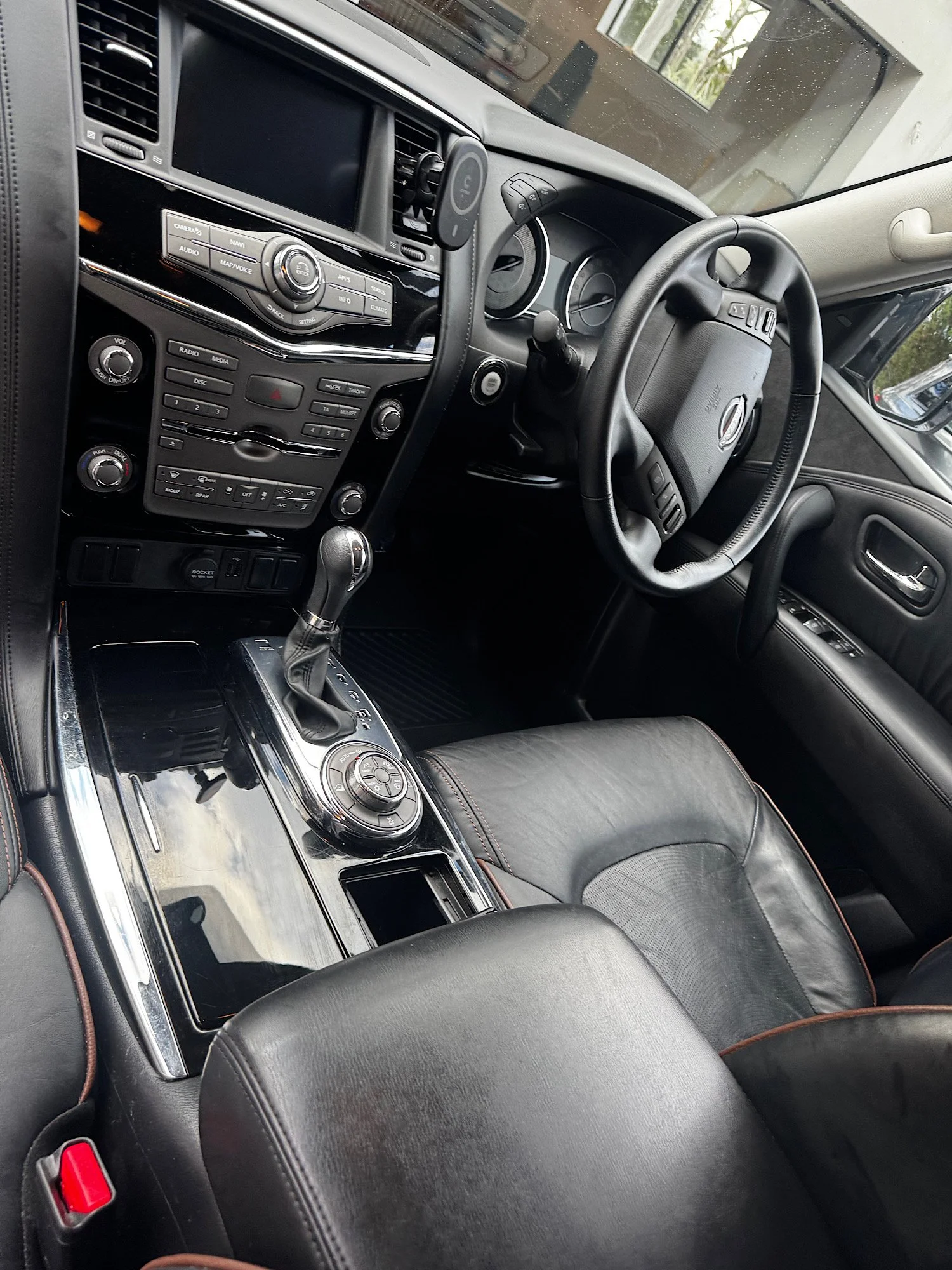Clean and detailed center console inside Nissan Patrol Warrior after interior detailing