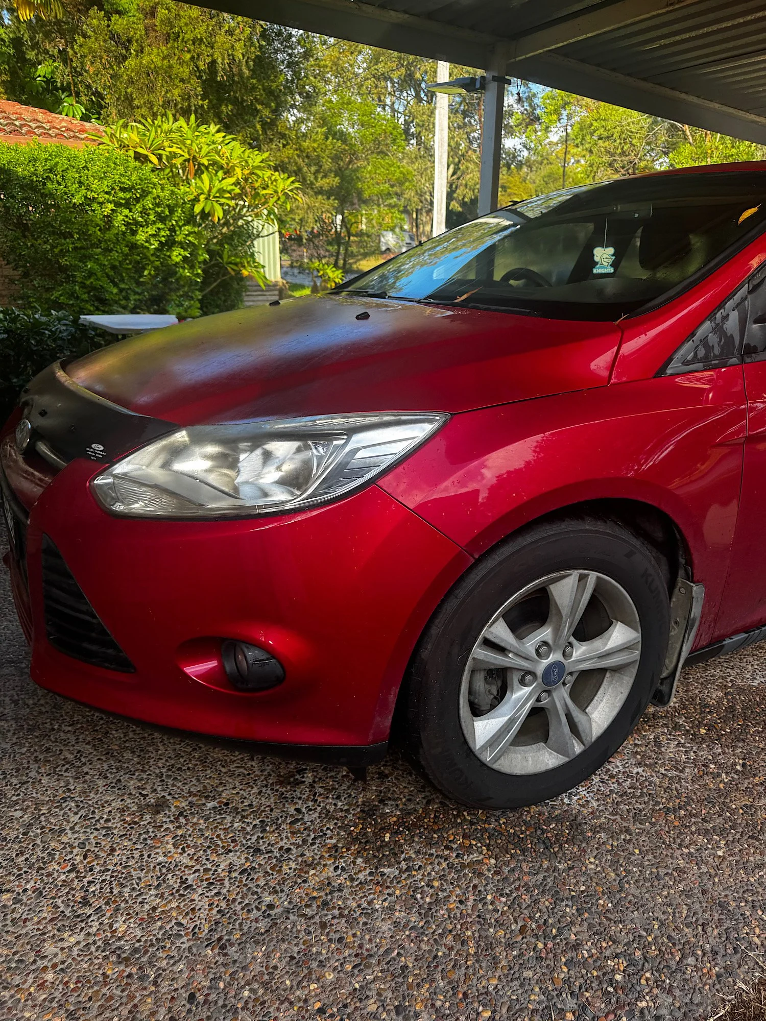 Ford Focus before detailing with faded paint and dull finish in Watanobbi NSW