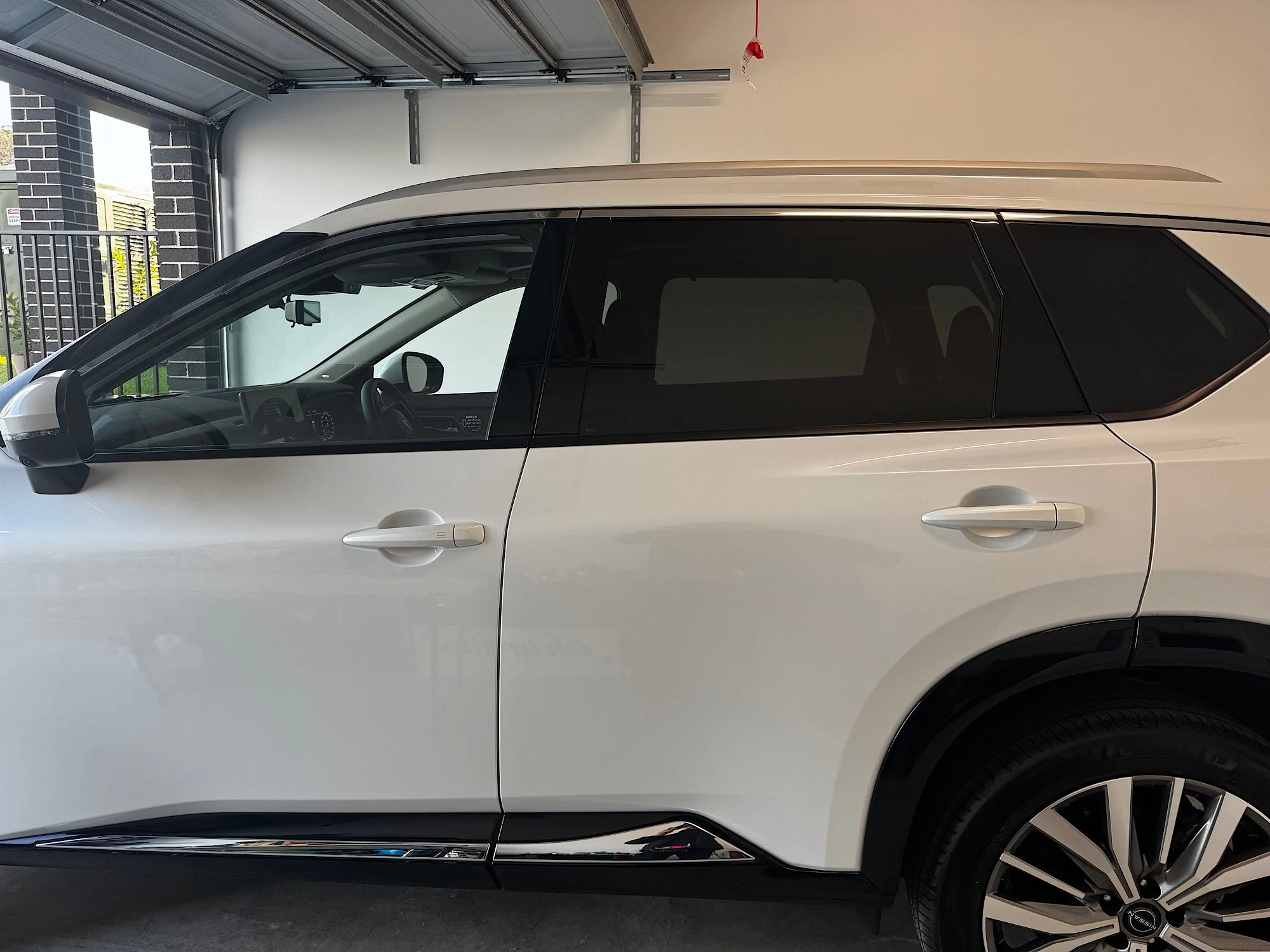 Nissan X-Trail e-4ORCE before window tint installation showing untinted front windows and factory privacy glass