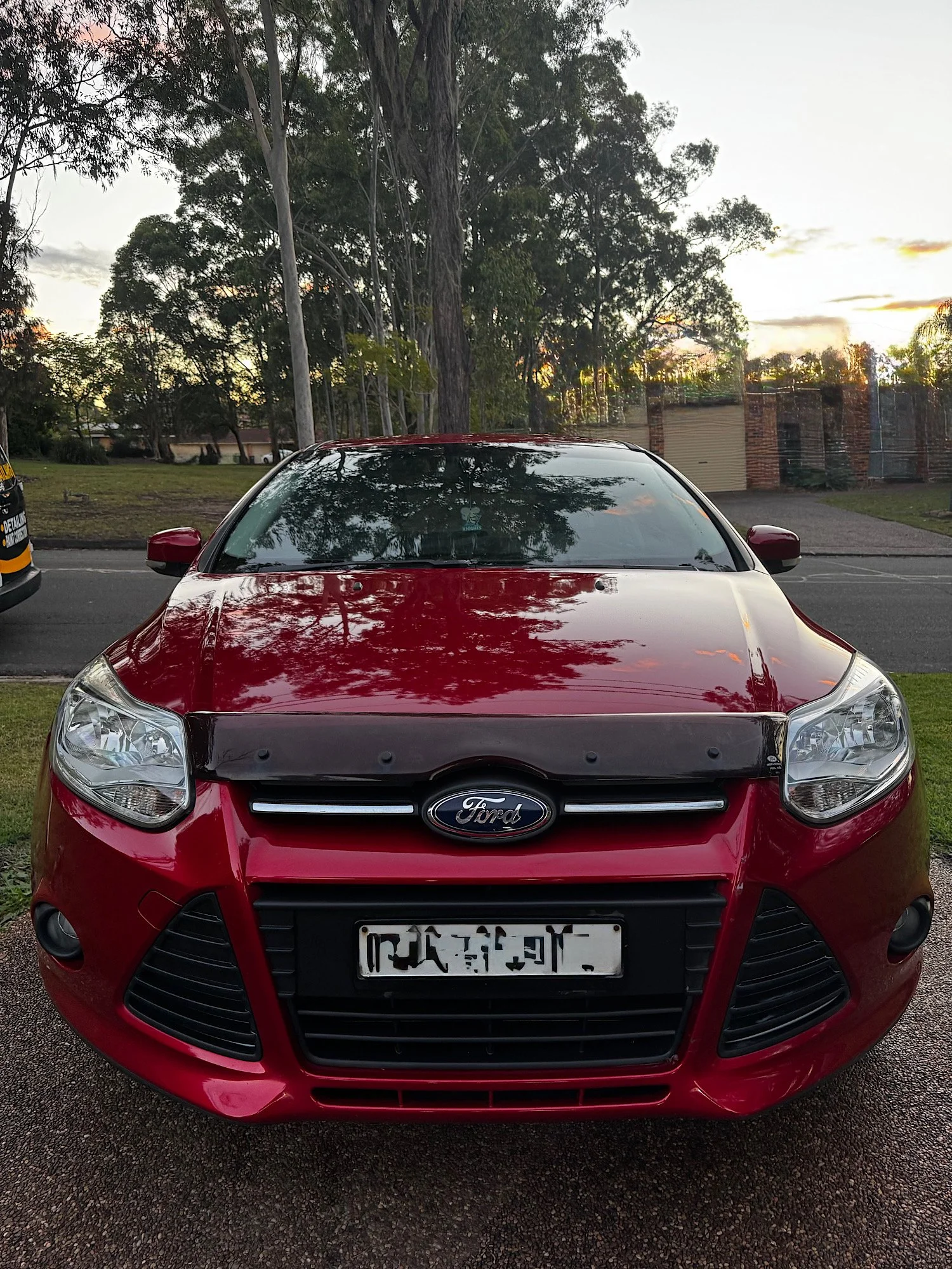 Front view of Ford Focus after detailing with restored gloss finish