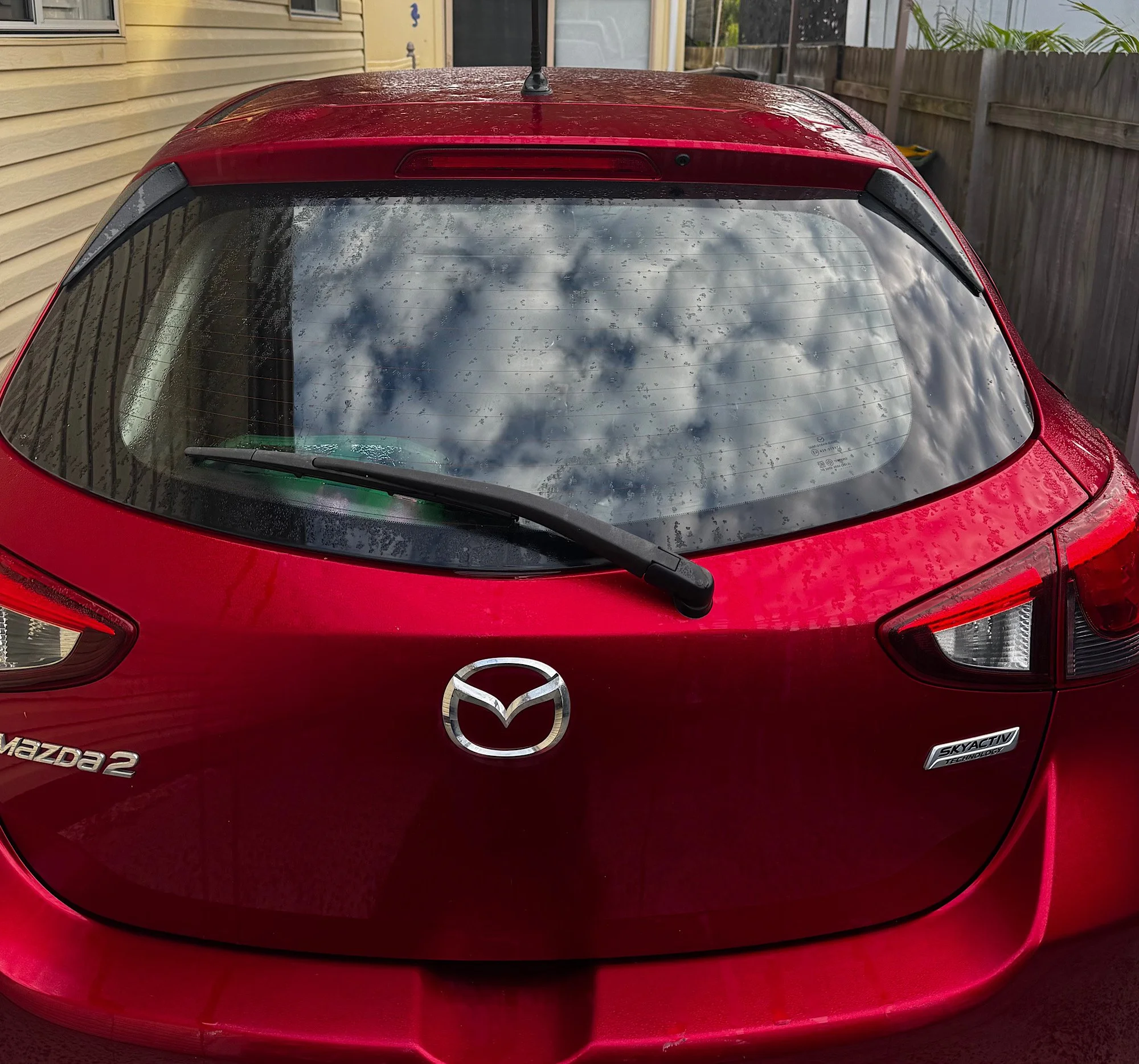 Mazda 2 Neo rear glass water spots before window tint installation