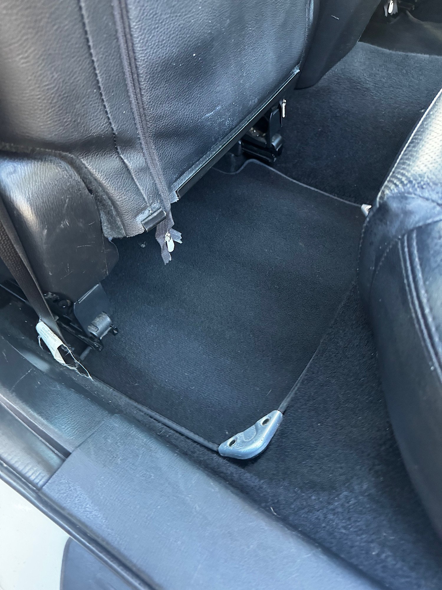 Under seat area cleaned and vacuumed after detailing Mazda 6