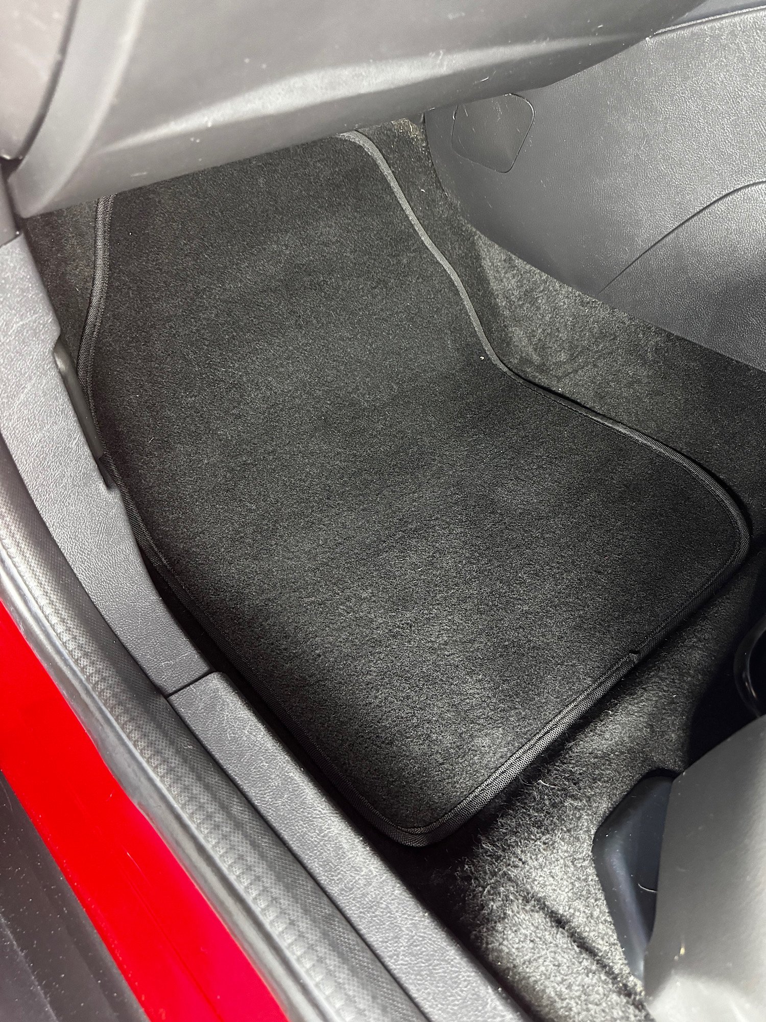Front passenger floor carpet after detailing and pet hair removal in Ford Focus