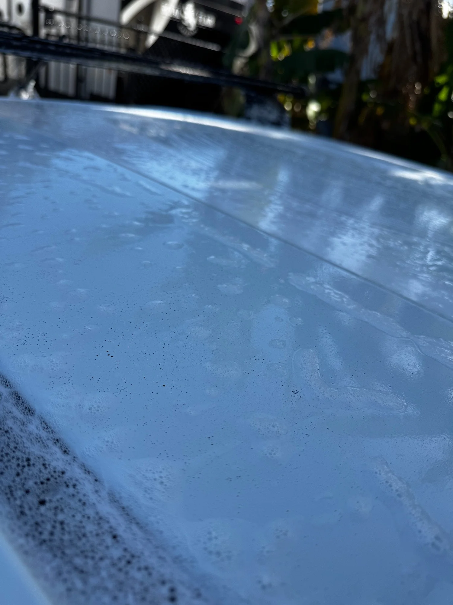 Heavy grime and environmental contamination on Mazda BT-50 roof before decontamination